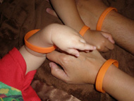 Picture of Gavin's family wearing the orange  wristband.